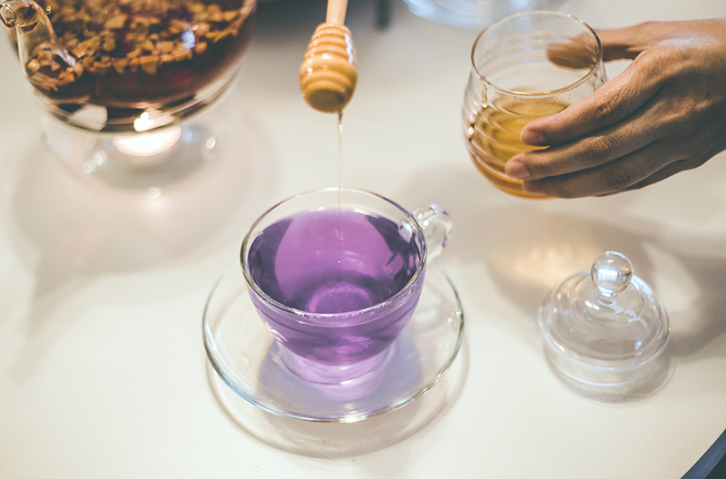 Image of lavender tea with honey dripping in 