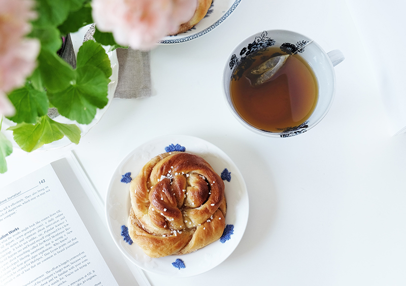 Picture of a book, pastry, and hot tea